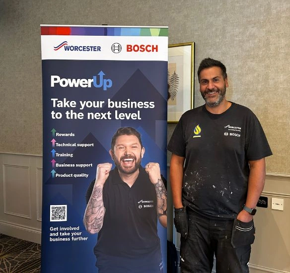 Installer in front of pull up at Worcester roadshow